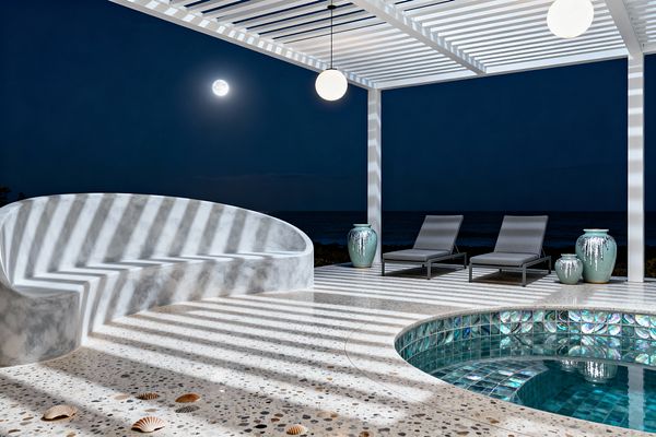 A moonlit coastal patio features a white slatted pergola casting striped shadows over a speckled terrazzo deck, a curved smooth concrete built-in bench, and a small circular plunge pool lined with iridescent teal glass mosaic. Two gray chaise lounges with black metal frames sit beside aqua glazed ceramic planters, while opal globe pendants glow softly and the dark ocean horizon shimmers in the background.