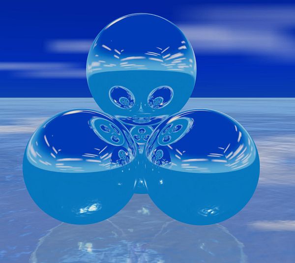 3D rendered scene of several colorful spheres with reflective surfaces inside a white curved environment.