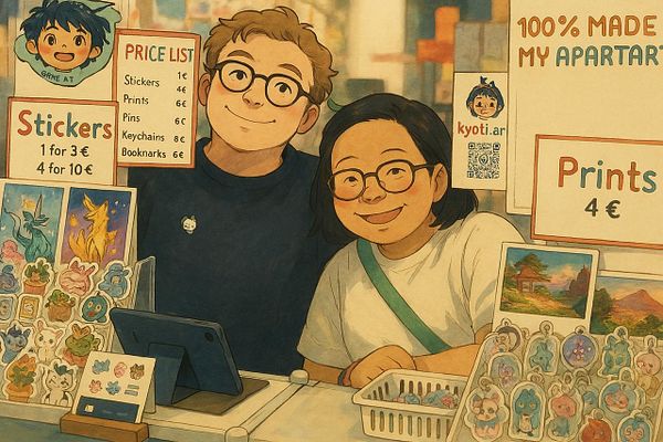 A cheerful couple is behind a vendor booth displaying various art items and a price list.