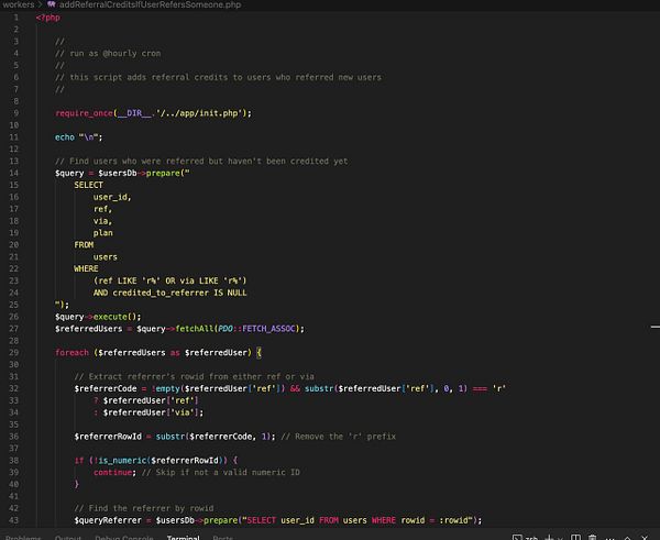 The image displays a code snippet from a PHP script designed to add referral credits to users.