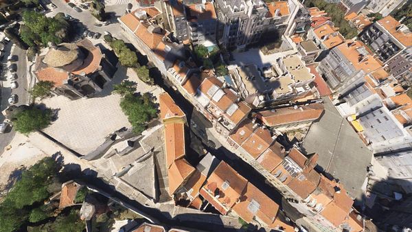 An aerial view of a Lisbon neighborhood showcasing its distinctive architecture and layout.