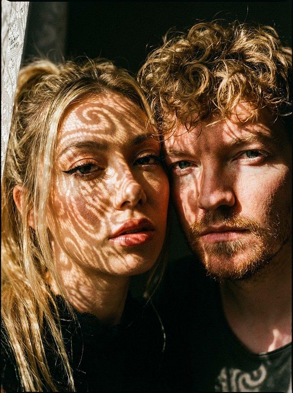 A digital illustration of a female character in colorful attire resembling a futuristic or fantasy style.