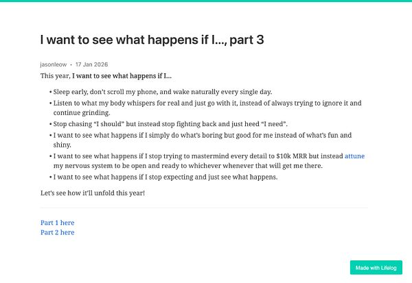 A pair of hands holds a flying drone above a wooden surface.