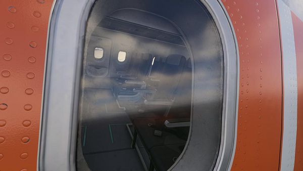 A detailed digital flight simulator cockpit view during an emergency landing approach at night.