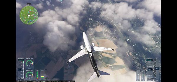 A flight simulation view from an aircraft flying over a cloud-covered landscape near Paris.