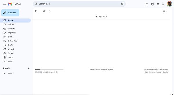 The image displays a Gmail interface showing an empty inbox with no new mail.