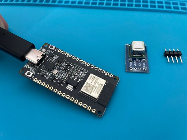 The image displays electronic components for a CO2 HomeKit sensor project.