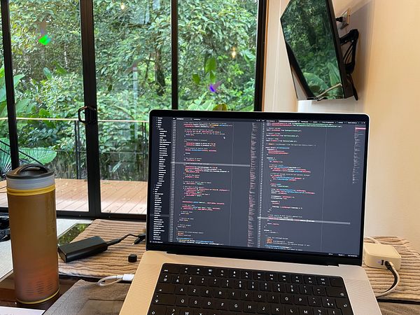 Screenshot of a code editor interface showing a JavaScript code file named Chatbox.jsx with syntax highlighting and error/warning indicators.