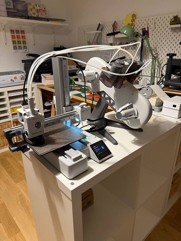 A workspace featuring a sophisticated machine setup for a project.