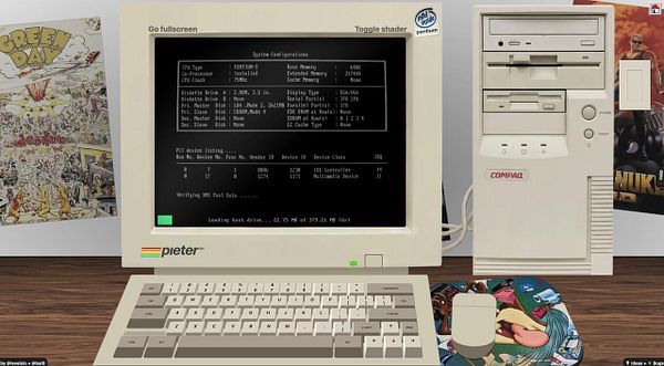 Image of a black Compaq PC tower placed next to an older computer monitor showing code or terminal output.