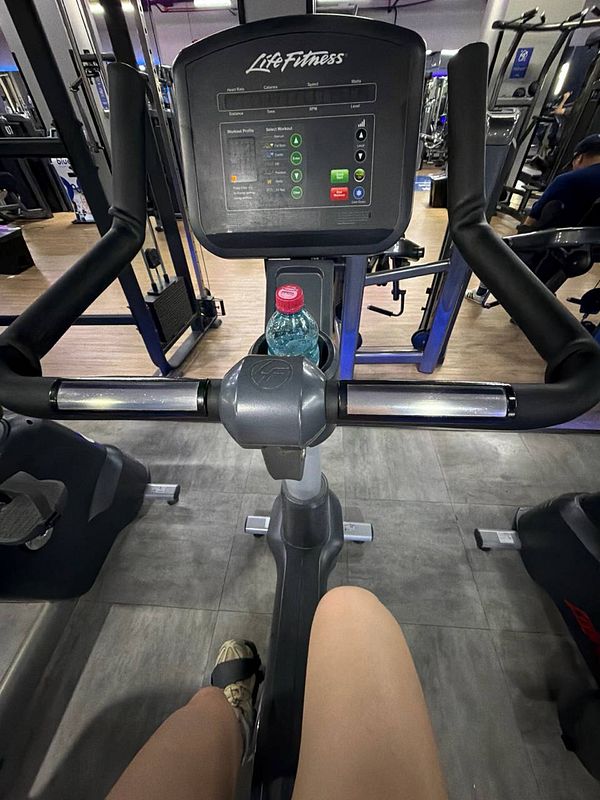 Black and white artistic photograph of a person preparing for a gym session.