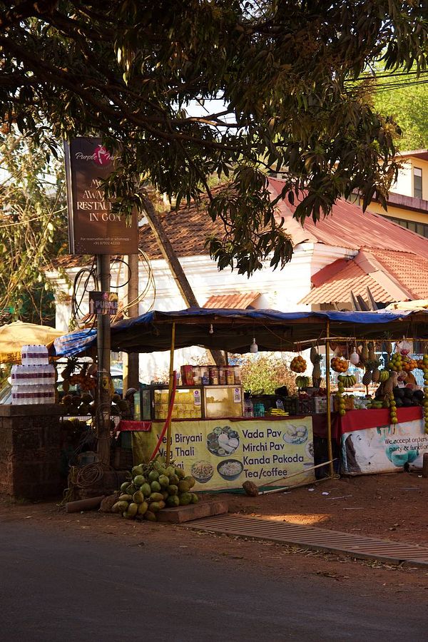 A roadside food stall in Goa offering various local dishes and beverages.