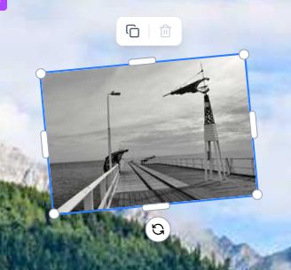 A black and white photograph of a pier extending into the water, with a lighthouse-like structure at the end.