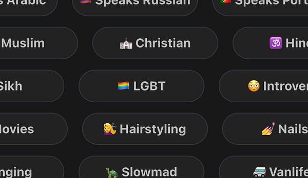 A colorful rectangular pride flag with horizontal stripes in multiple colors arranged diagonally and an additional yellow to red gradient segment.