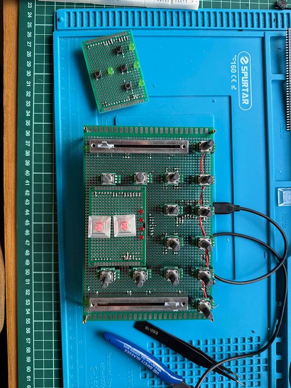 Close-up macro shot of a custom MIDI controller circuit board with components soldered on a brown perforated board.