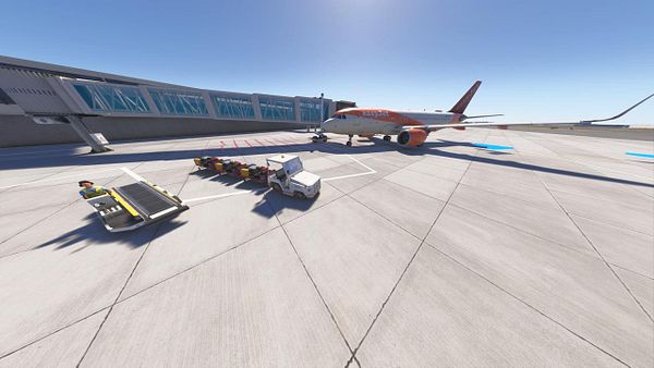 An airport scene featuring an aircraft and ground service vehicles.