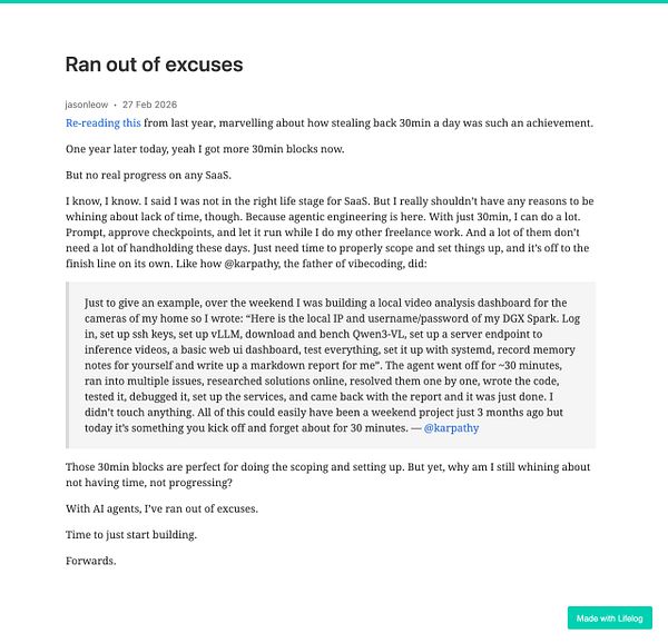 A teardrop-shaped glass prism with multiple light refractions is placed on a dark wooden surface.