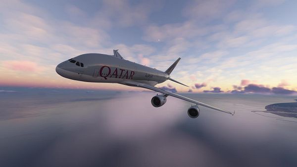 A Qatar Airways airplane is flying over a scenic landscape during sunset.