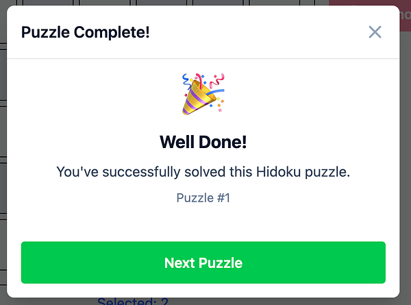 A modal window celebrating the completion of a Hidoku puzzle.