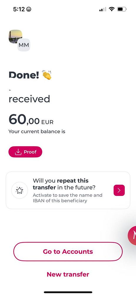 Interior of a modern event venue with a stage, blue ambient lighting, and seating for a meetup event.