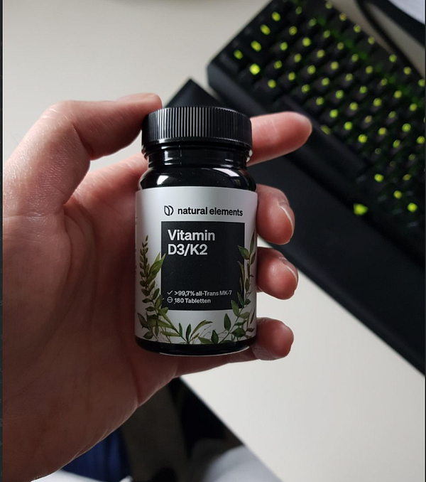 Illustration of a human brain with various colorful interconnected shapes and figures inside, symbolizing a complex neural network.