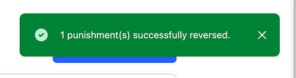 A notification indicating the successful reversal of a punishment in a dashboard interface.