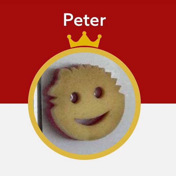 A smiling cookie with a playful design is featured in a circular frame.