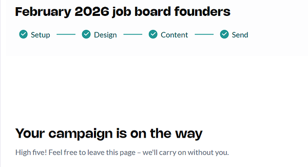 A modern workspace with a laptop open to an email or newsletter editing tool, surrounded by stationery and a cup of coffee.