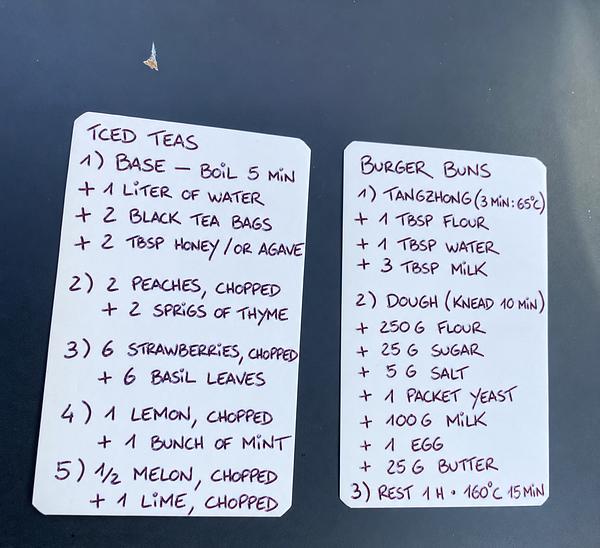 Handwritten recipes for iced teas and burger buns on two white cards with rounded corners.