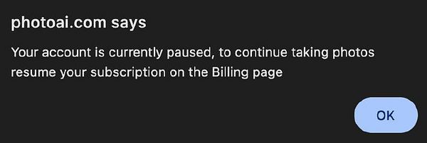 A notification from photoai.com indicating that the user's account is paused.