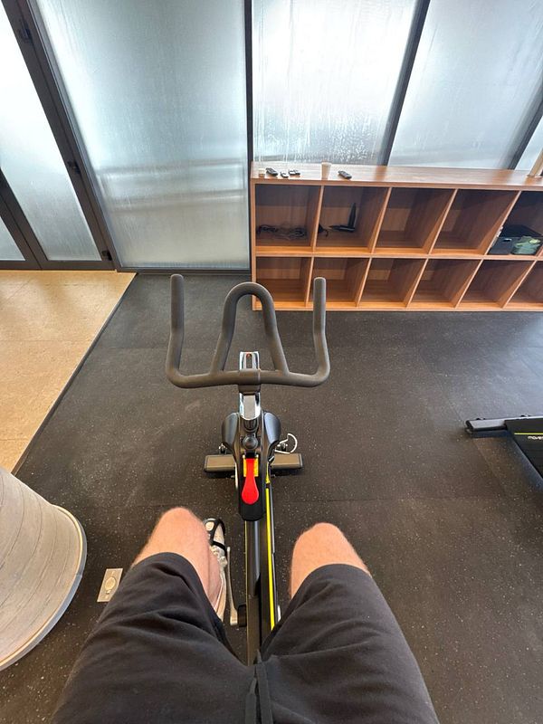 A view from above a stationary bike in a gym setting.