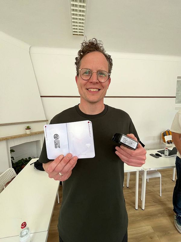 Rubber stamp engraved with the Ruby on Waves logo design, accompanied by its carved rubber stamp face.