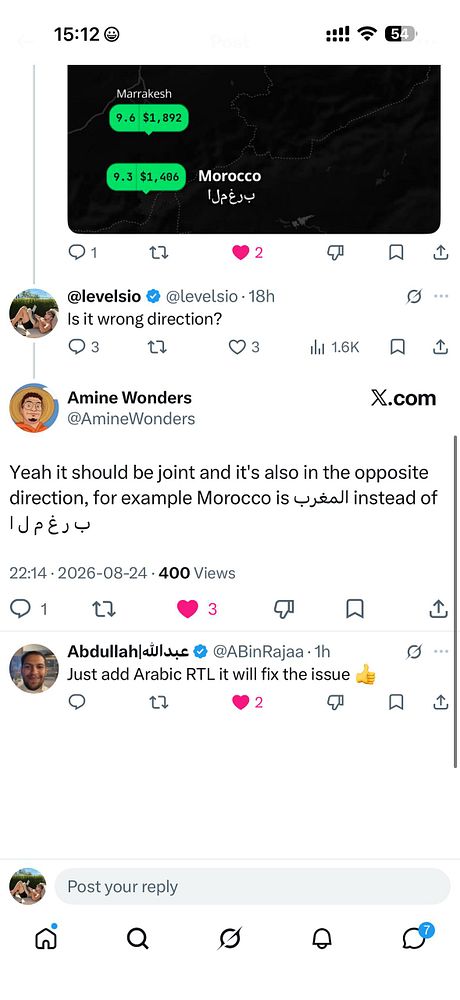 Mobile app interface displaying a partially visible map with distorted and improperly aligned Arabic RTL text labels over buildings and streets.