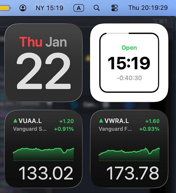 Portrait of a bald man smiling in front of a brightly colored abstract permanent marker mural.