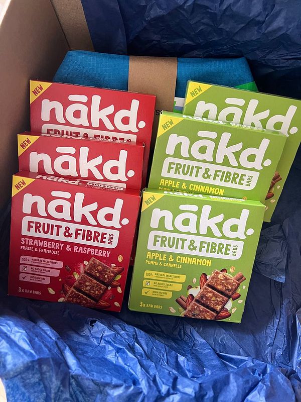 A box filled with Nakd fruit and fiber bars in various flavors.