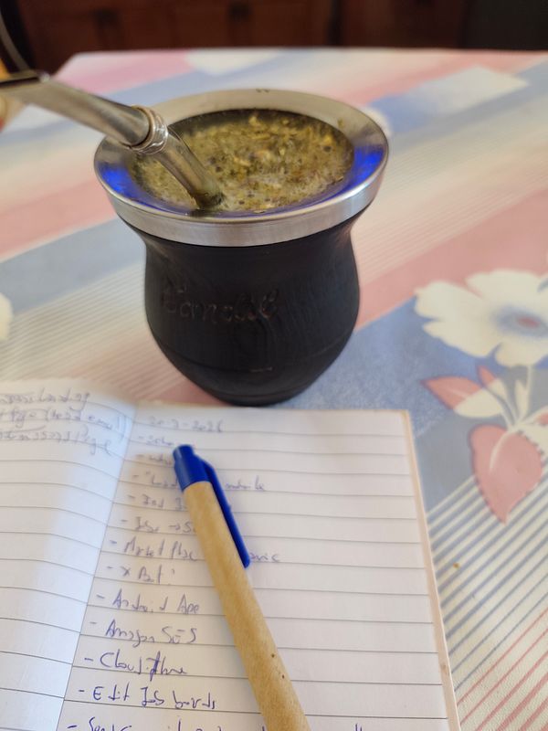 A cozy scene of two takeaway coffee cups featuring friendly illustrations and text with a wooden table background.