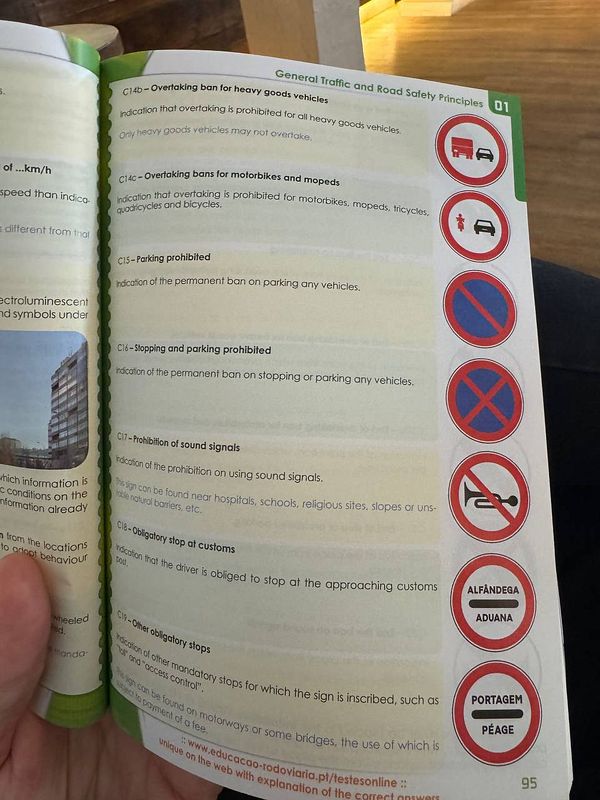 The image displays a page from a driving manual focused on traffic signs and regulations.