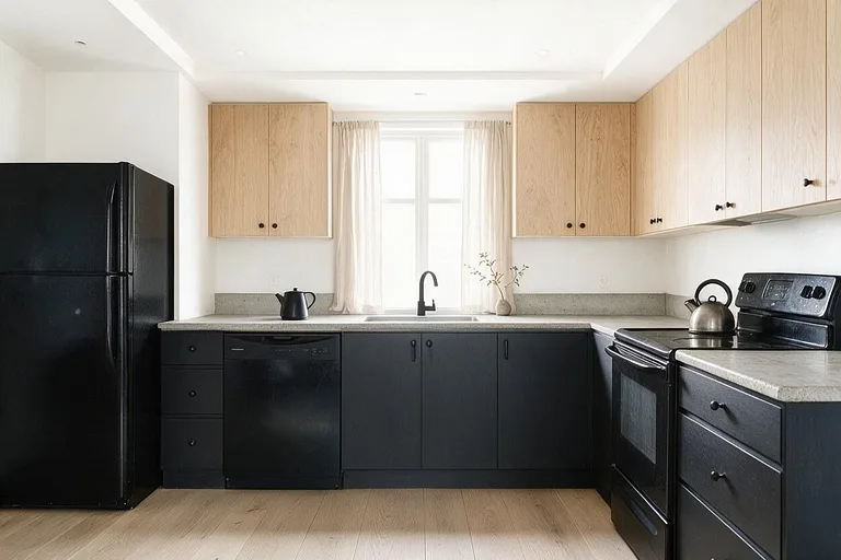 A Minimalist kitchen in the Charcoal and Oak palette: white, charcoal, pale oak, concrete gray, and matte black