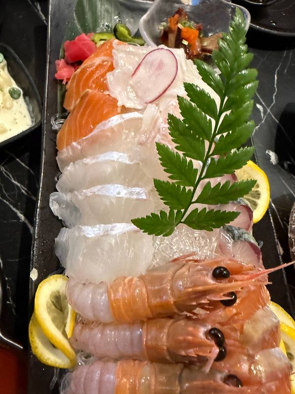 A close-up photo of Korean sushi rolls arranged on a wooden serving board.