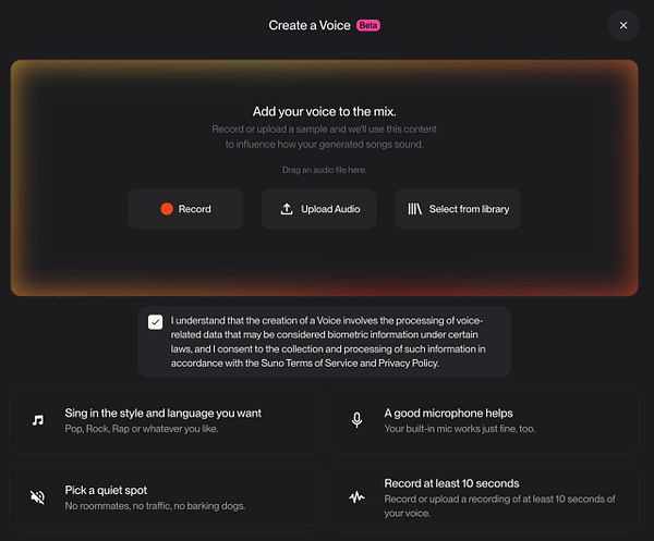 Photograph of Calla lilies in a white rectangular vase with books and a wooden chair in the background.