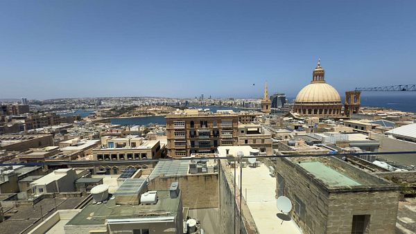 A panoramic view of Valletta, Malta, showcasing its historic architecture and coastal scenery.