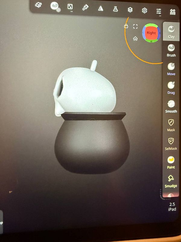 A 3D modeling interface displays a stylized skull design intended for a keychain prototype.