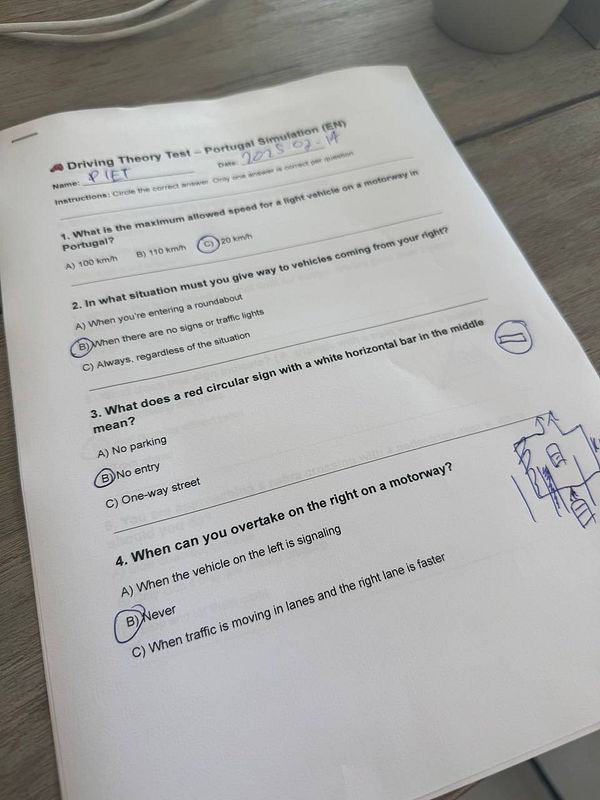 A printed driving theory test paper for Portugal with multiple-choice questions.