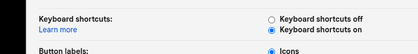 The image displays a settings interface for enabling keyboard shortcuts in Gmail.