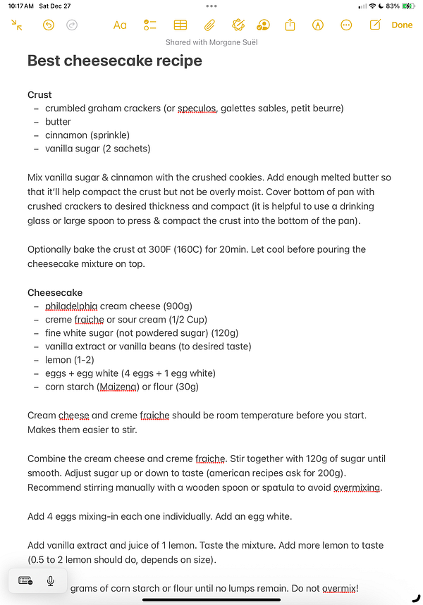 A detailed cheesecake recipe is displayed on a digital note.