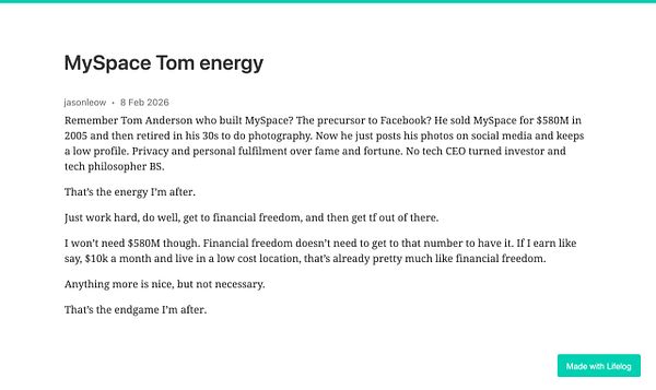 Close-up photo of a plush Tom from MySpace wearing a white t-shirt, seated outdoors with a blurred wood and green foliage background.