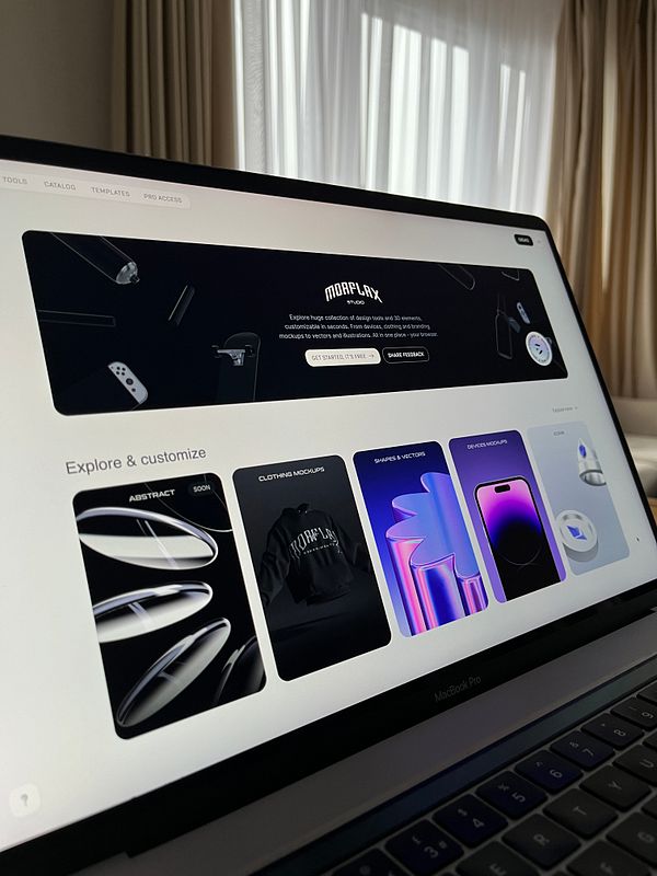 The image displays a laptop screen showcasing the Morflax Studio website interface.