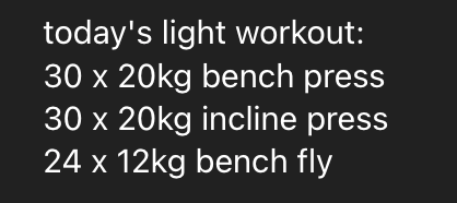 A home gym setup featuring workout equipment including a treadmill, a stationary bike, weight racks, and a large wall mirror.