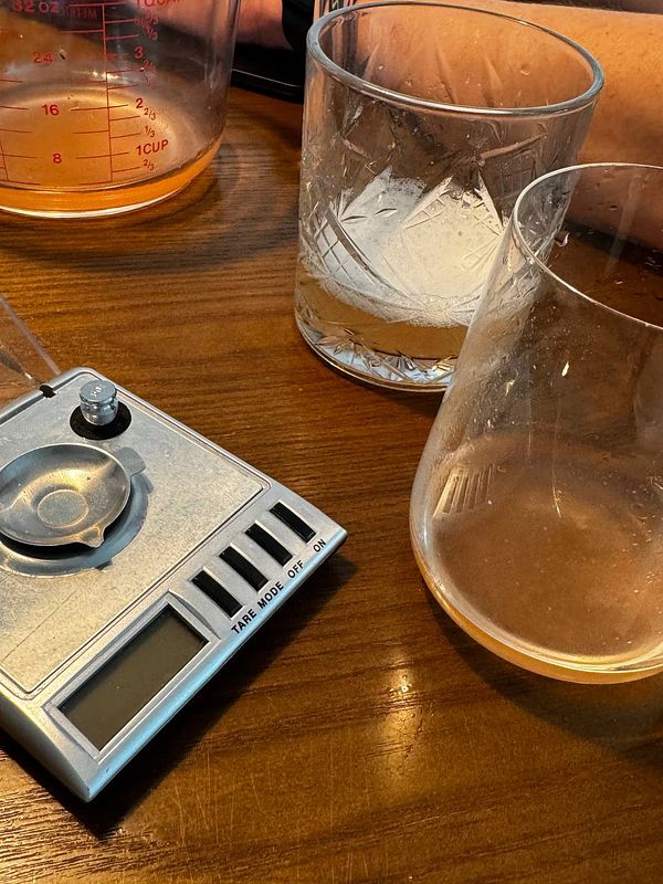 Close-up of ice cream scoops in a container labeled with their flavors.