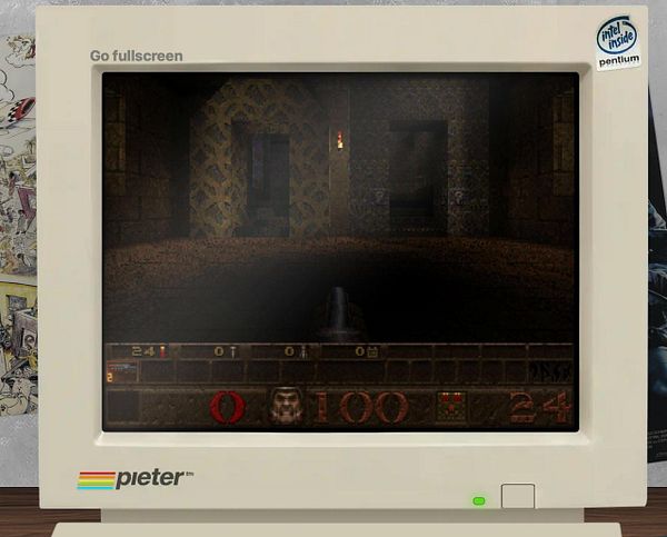 A vintage computer monitor displays a video game interface with a dark, textured environment.